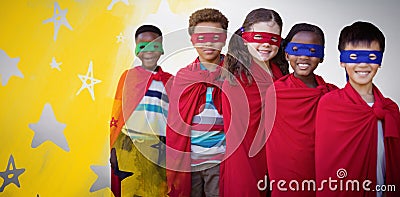 Composite image of smilnig children in superhero costumes Stock Photo