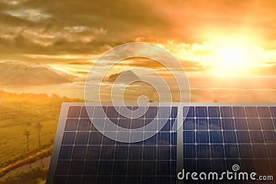 Composite image of solar panel equipment against sunset over sea Stock Photo