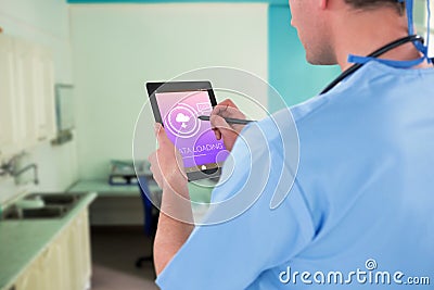 Composite image of surgeon using digital tablet Stock Photo