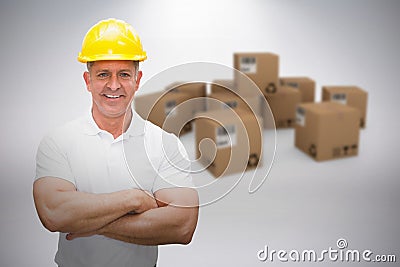Composite image of worker wearing hard hat in warehouse Stock Photo