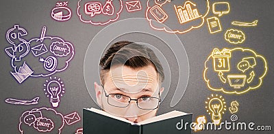 Composite image of young geek looking over black book Stock Photo