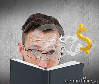 Composite image of young geek looking over black book Stock Photo