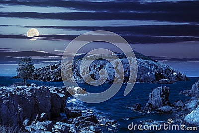 Composite island with hills and castle at night Stock Photo