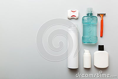 Composition with bath cosmetics on table. razor, toothpaste, soap, gel, toothbrush, mouthwash and other various Stock Photo