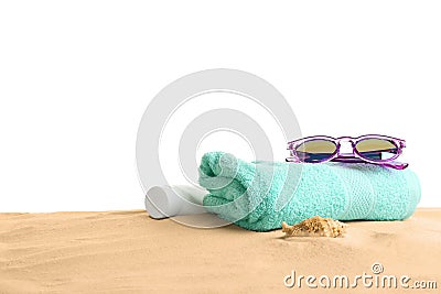 Composition with beach sand, sunglasses and towel on white background Stock Photo