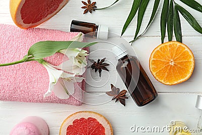 Composition with bottles of citrus essential oils on table Stock Photo