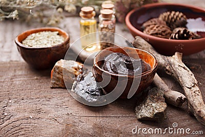 Composition with bottles of essential oils on table. Natural cosmetics, homeopathy, alternative traditional medicine concept. Stock Photo