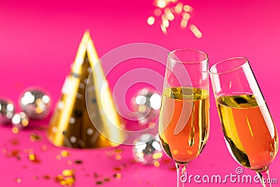 Composition of close up of new years champagne and decorations on pink background Stock Photo