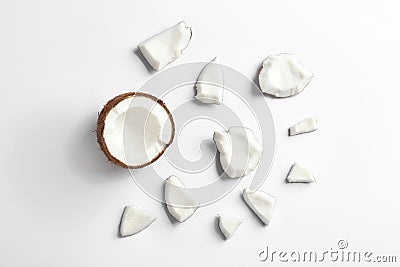 Composition with coconut pieces on white, top view Stock Photo