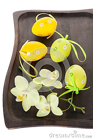 Composition with colorful Easter eggs and flowers orchids Stock Photo