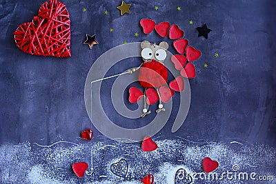 Composition of decorative objects on the theme of love. A wooden mouse sits on the moon of red hearts and catches red hearts with Stock Photo