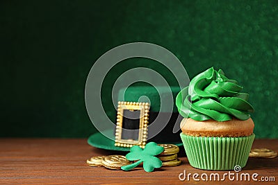 Composition with delicious decorated cupcake on table. St. Patrick`s Day celebration Stock Photo