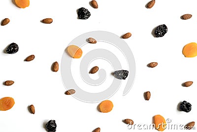 Composition of dried fruit and nuts pattern. Pieces of apricots, plums, almonds. Stock Photo