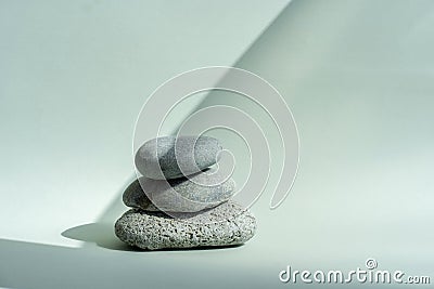 Composition empty podium material stone. Pastel green background. Beautiful background made of natural materials for Stock Photo