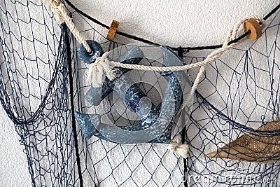 Composition from the fishing net on the wall of the house Stock Photo