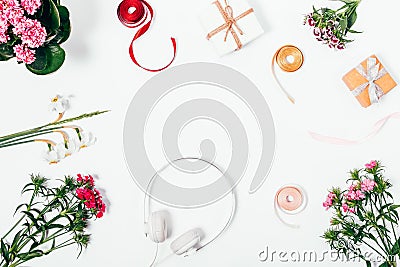 Composition of flowers, headphones, gift boxes Stock Photo