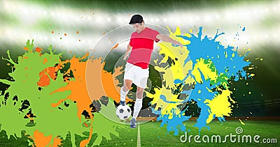 Composition of football player with ball over colourful splodges and sports stadium Stock Photo