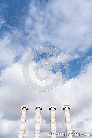 Composition of four ionic column with cloudy sky in the background in vertical view / copy space / pillar /architecture / minimal Stock Photo