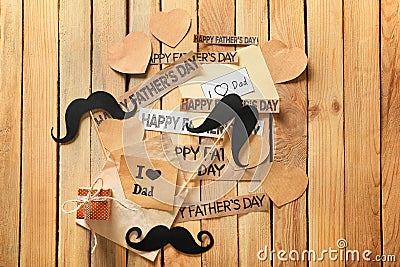 Composition with gift box and papers with text HAPPY FATHER\'S DAY on wooden background Stock Photo