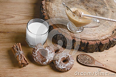 Composition gingerbreads, milk and honey and spices - cinnamon, coriander, stuffed gingerbread on a wooden background, top view, c Stock Photo