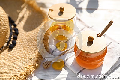 Composition with glass jar of fresh rose honey on white wooden table Stock Photo