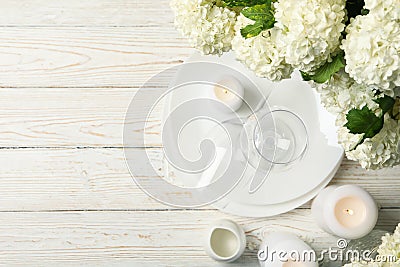 Composition hydrangea flowers on wooden background, top view. Romantic evening Stock Photo