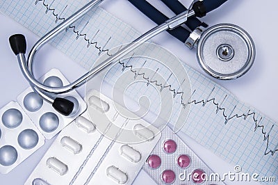 Composition or idea for the medical direction of internal medicine: a stethoscope, electrocardiogram EKG or ECG and a set of wh Stock Photo