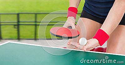 Composition of mid section of female table tennis player holding ball and racket Stock Photo