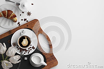 Composition of morning breakfast with a cup of coffee and a croissant on a white background. Banner with copy space for text. A se Stock Photo