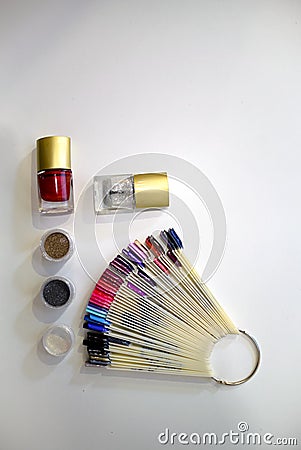 Composition of nail polish, glitter and bright nail samples Stock Photo