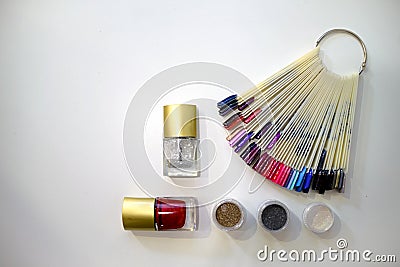 Composition of nail polish, glitter and bright nail samples Stock Photo