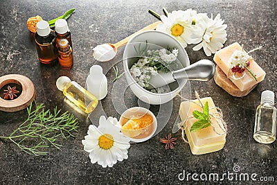 Composition with natural cosmetics and chamomile flowers on table Stock Photo