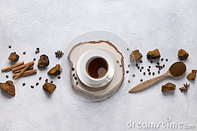 Chaga infusion beverage in cup. Trendy Russian healthy infusion Stock Photo