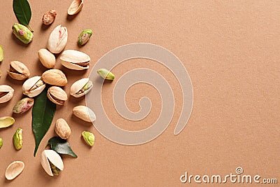 Composition with organic pistachio nuts on color background, flat lay Stock Photo