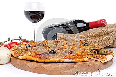 Composition with a pizza, a glass and a bottle of wine Stock Photo