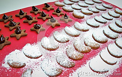 Homemade pepper ginger mini biscuits in various forms, with chocolate and icing sugar Stock Photo
