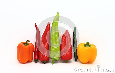 Composition of several types of sweet pepper of different shapes, colors and sizes on a light background. Stock Photo