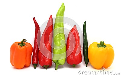Composition of several types of sweet pepper of different shapes, colors and sizes on a light background. Stock Photo