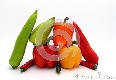 Composition of several types of sweet pepper of different shapes, colors and sizes on a light background. Stock Photo