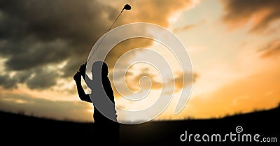 Composition of silhouette of golf player over clouds on orange sky with copy space Stock Photo