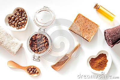 Composition of spa treatment. Coffee scrub, coffee soap and oil on white background top view Stock Photo