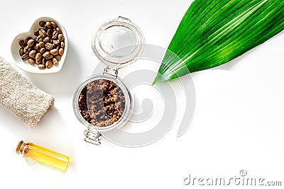 Composition of spa treatment. Coffee scrub, coffee soap and oil on white background top view copyspace Stock Photo