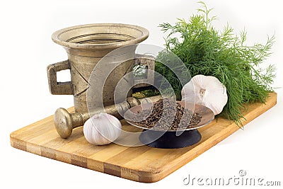 Composition of spices, cumin, dill, garlic, vintage spice grinder isolated on white background Stock Photo