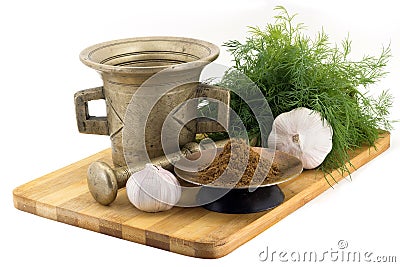 Composition of spices, Indian masala, dill, garlic, vintage spice grinder isolated on white background Stock Photo