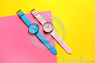 Composition with stylish wrist watches on color background, flat lay. Stock Photo