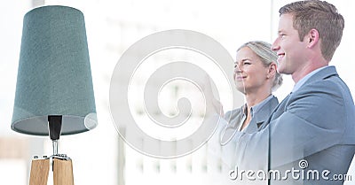 Composition of successful caucasian male and female business colleagues smiling over blurred office Stock Photo