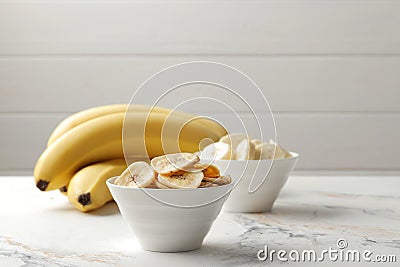 Composition with sweet banana slices , top view with space for text. Dried fruit as healthy snack. Stock Photo