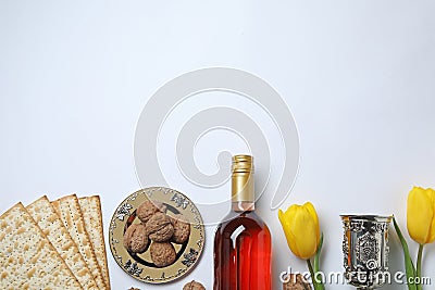 Composition with symbolic Passover Pesach items on white background, top view. Stock Photo