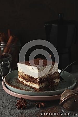 Composition with tiramisu coffee maker and cinnamon on gray table Stock Photo