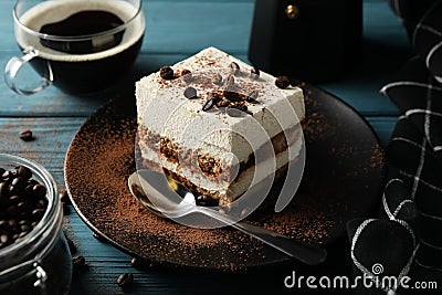 Composition tiramisu and coffee on wooden background. Tasty dessert Stock Photo